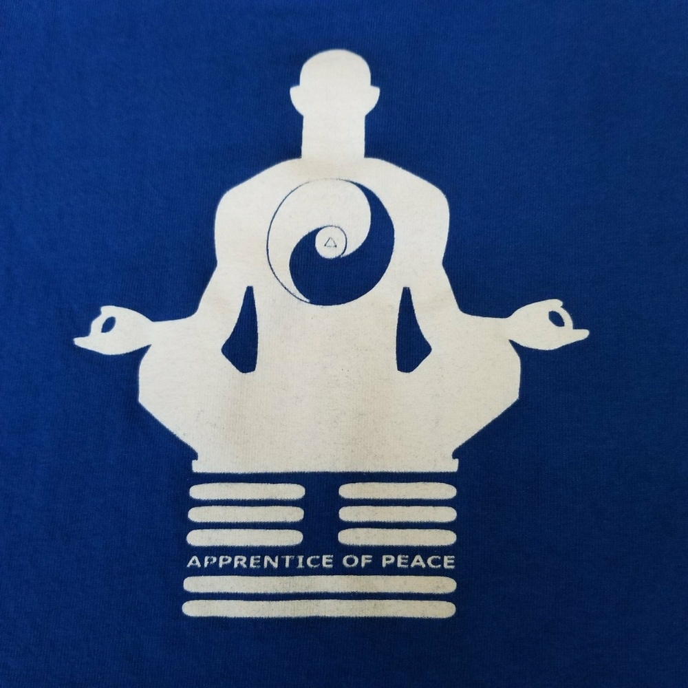 blue t-shirt with a yogi meditating